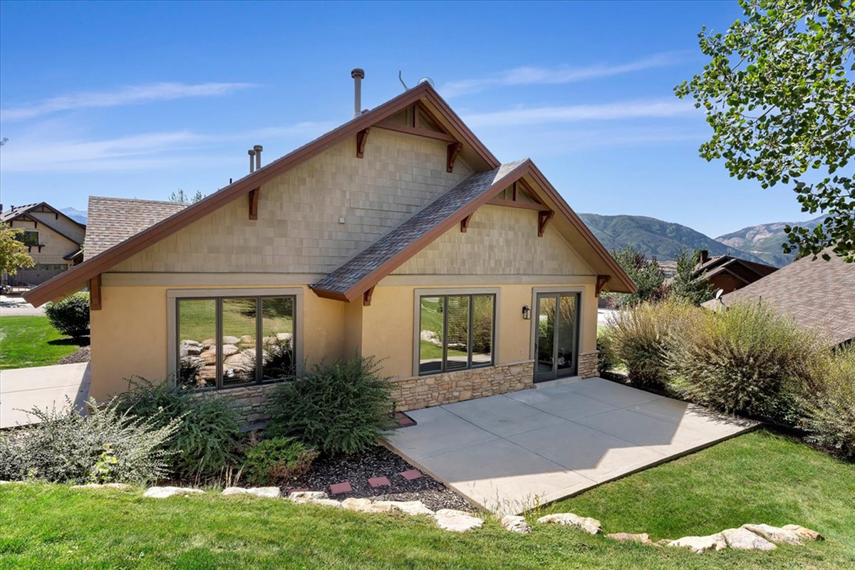 Welcome to your home away from home—charming curb appeal set against beautiful mountain surroundings.