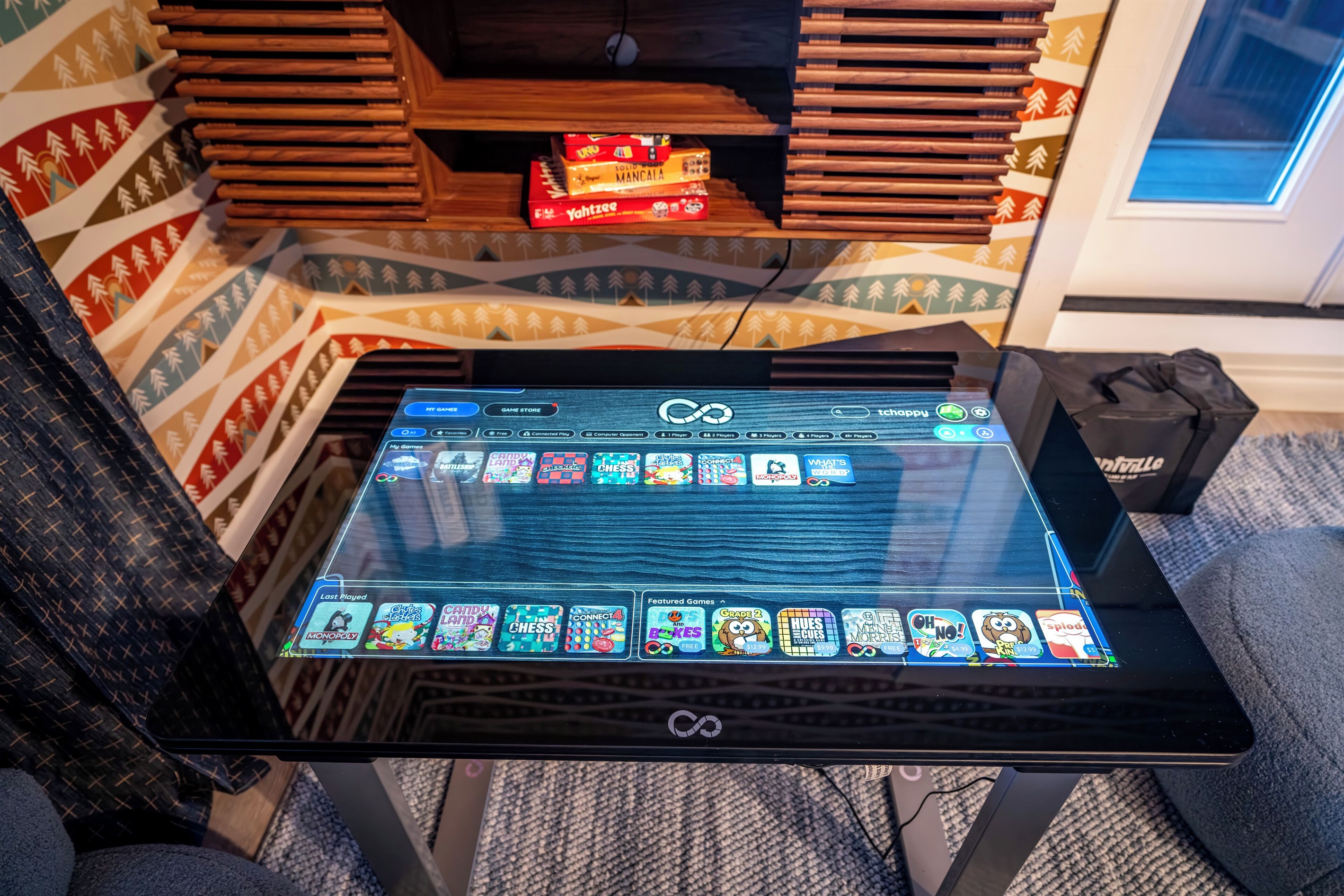 Infinity game table has 100's of classic board games in digital format