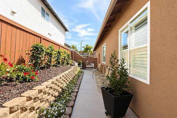 Sunny private walkway with seating outside the guest suite