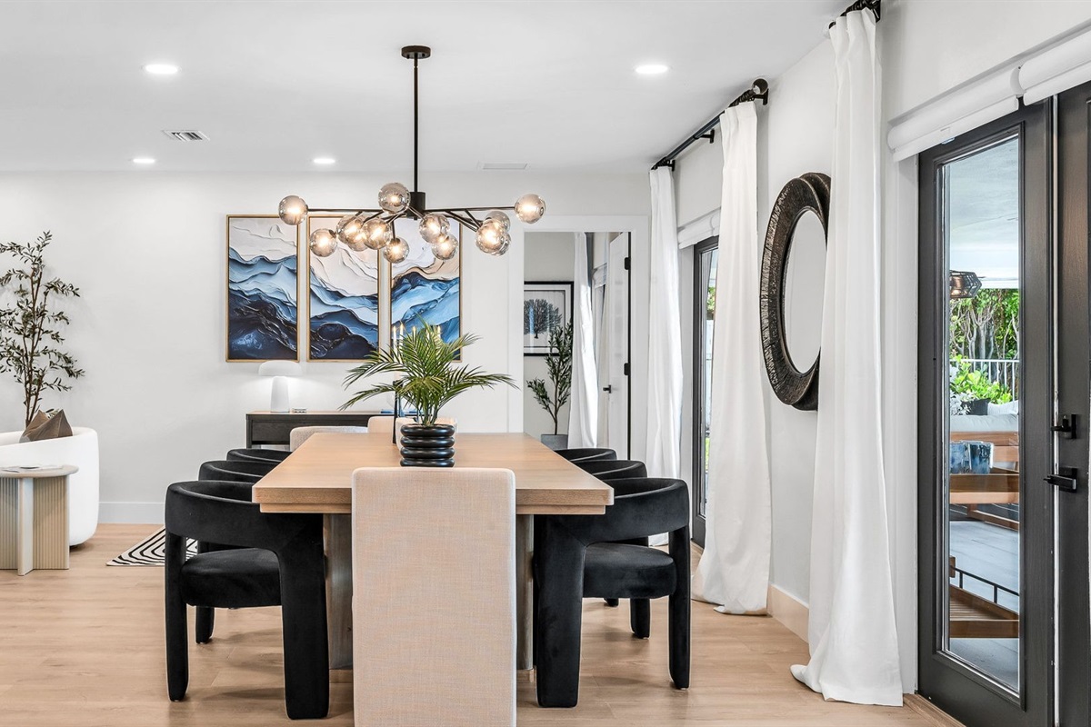 Experience resort-style dining with a designer table for 8 indoors and al fresco seating for 10 by the pool, offering an elegant backdrop for unforgettable gatherings