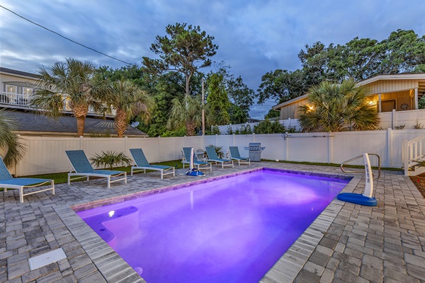 Enter a realm of enchantment as our swimming pool transforms under the night sky. Illuminated by gentle lights, its waters shimmer with quiet elegance, inviting you to unwind in the tranquil embrace of evening. Welcome to your oasis