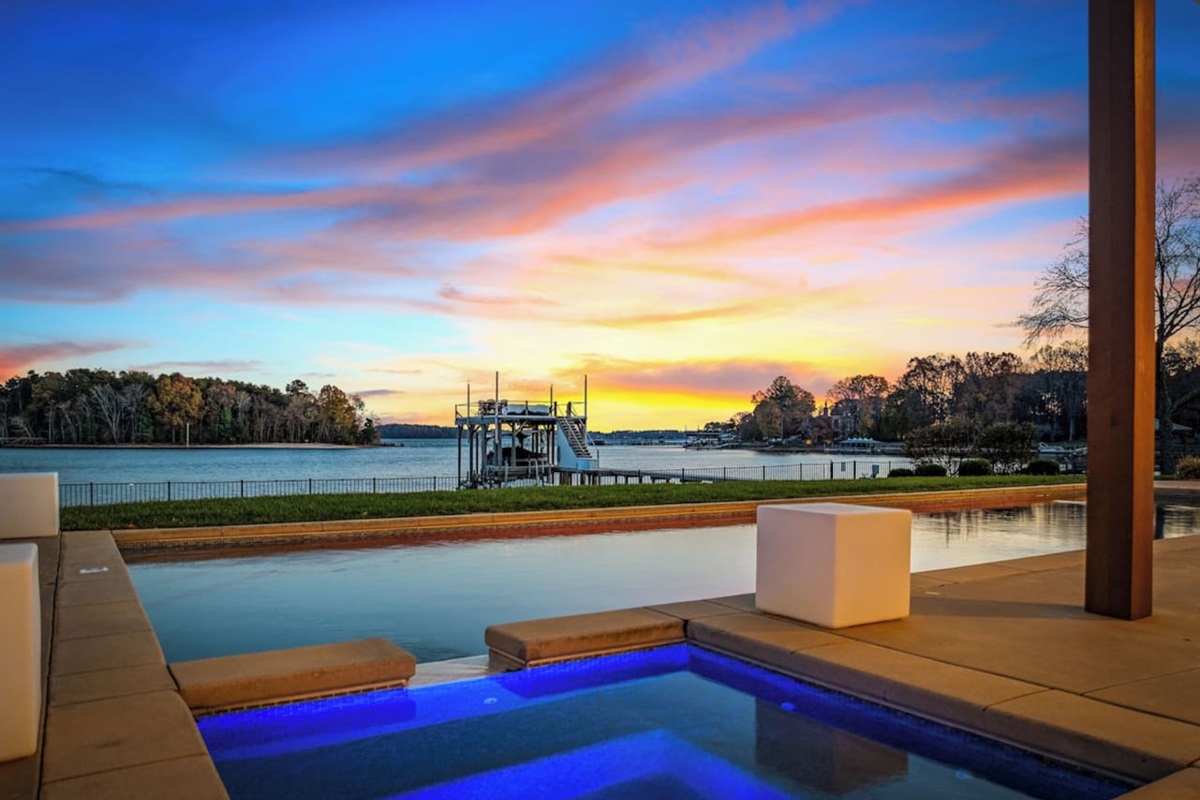 Relax in our lakefront hot tub at sunset!