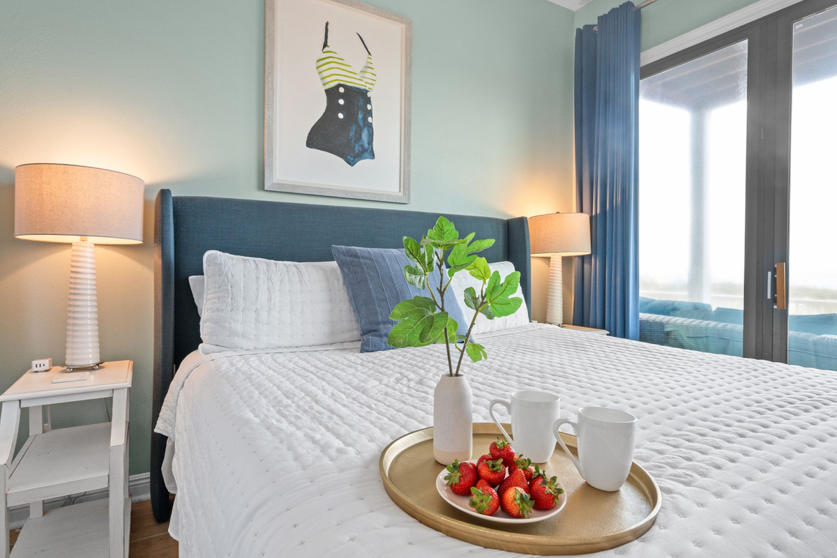 A warm and cozy retreat with an ensuite bath and floor-to-ceiling sliding doors leading to a scenic gulf-view deck.