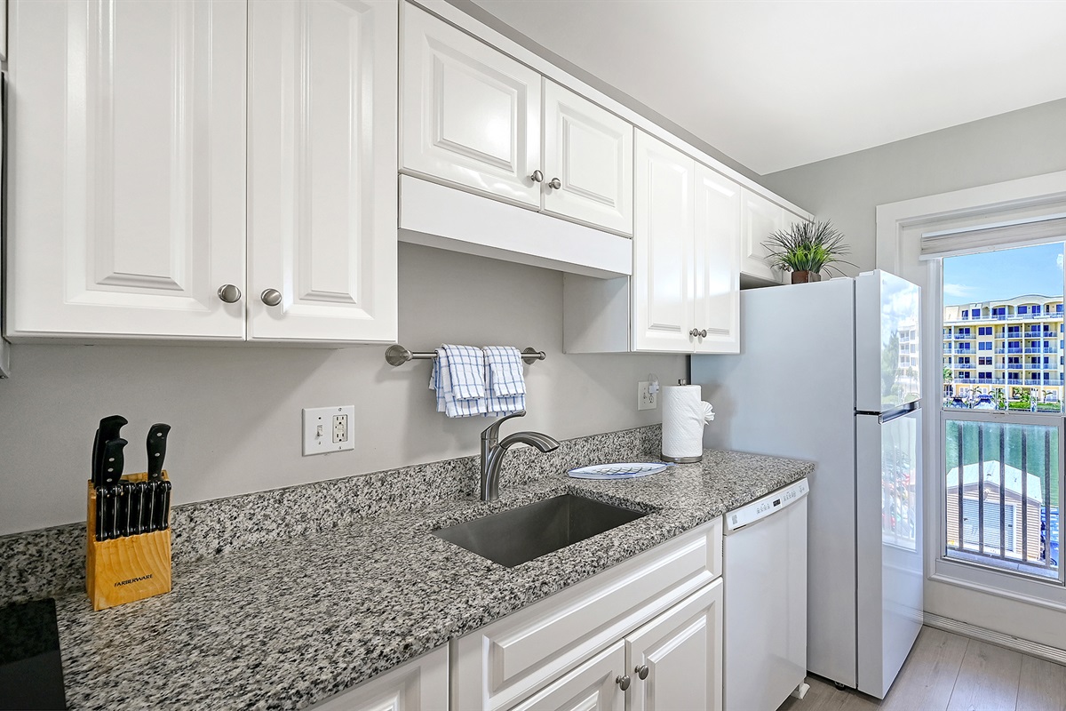 The kitchen also has a view of the inlet and boat docks