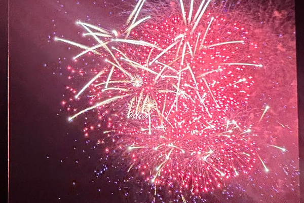 4th of July fireworks view from the living room sofa.  The fireworks show is launched from a barge in the middle of the lake, directly in front of our home.  It's an amazing view!