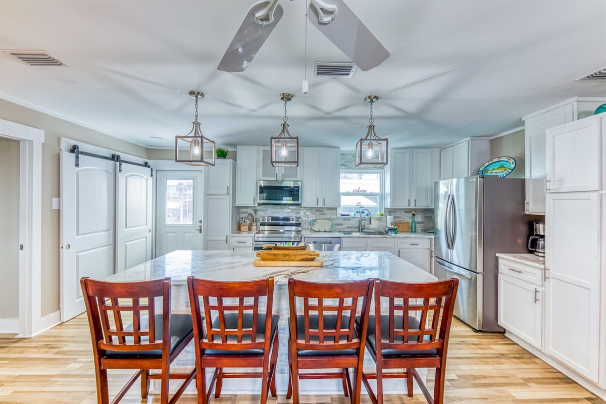 Kitchen Oasis: Modern design with stylish lighting and a spacious island for culinary adventures!