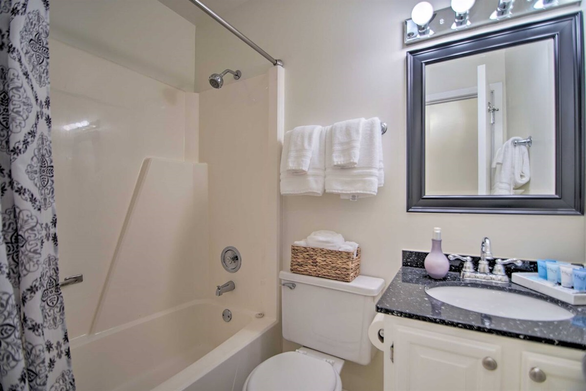 2Bd Unit:  The upstairs bathroom has a quartz countertop with sink, and a combination bathtub and shower.