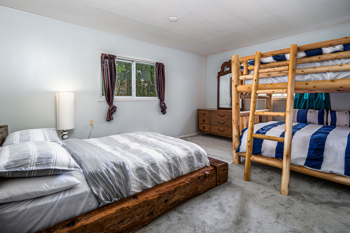 Family bedroom with bed and bunk sleeping area