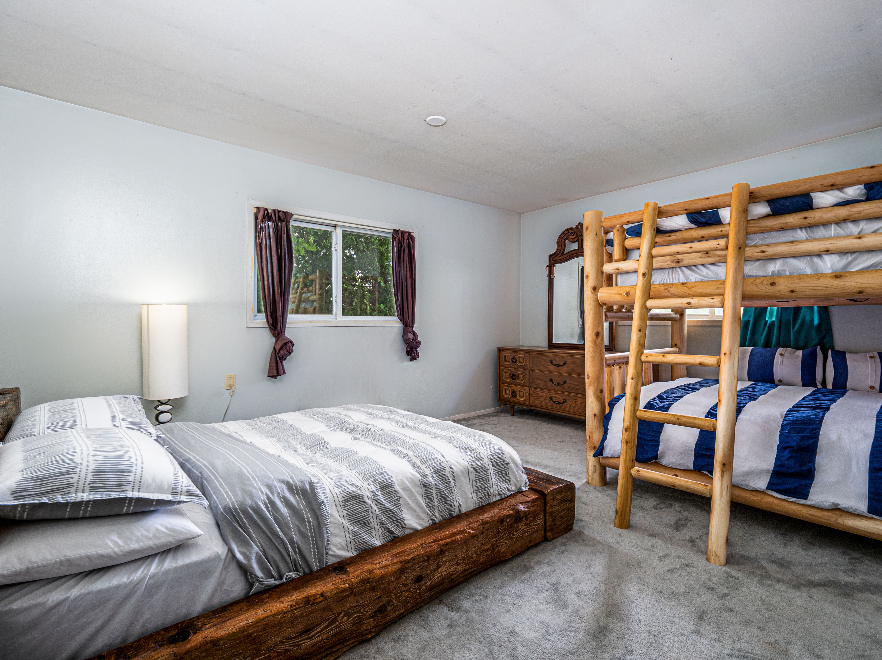 Family bedroom with bed and bunk sleeping area