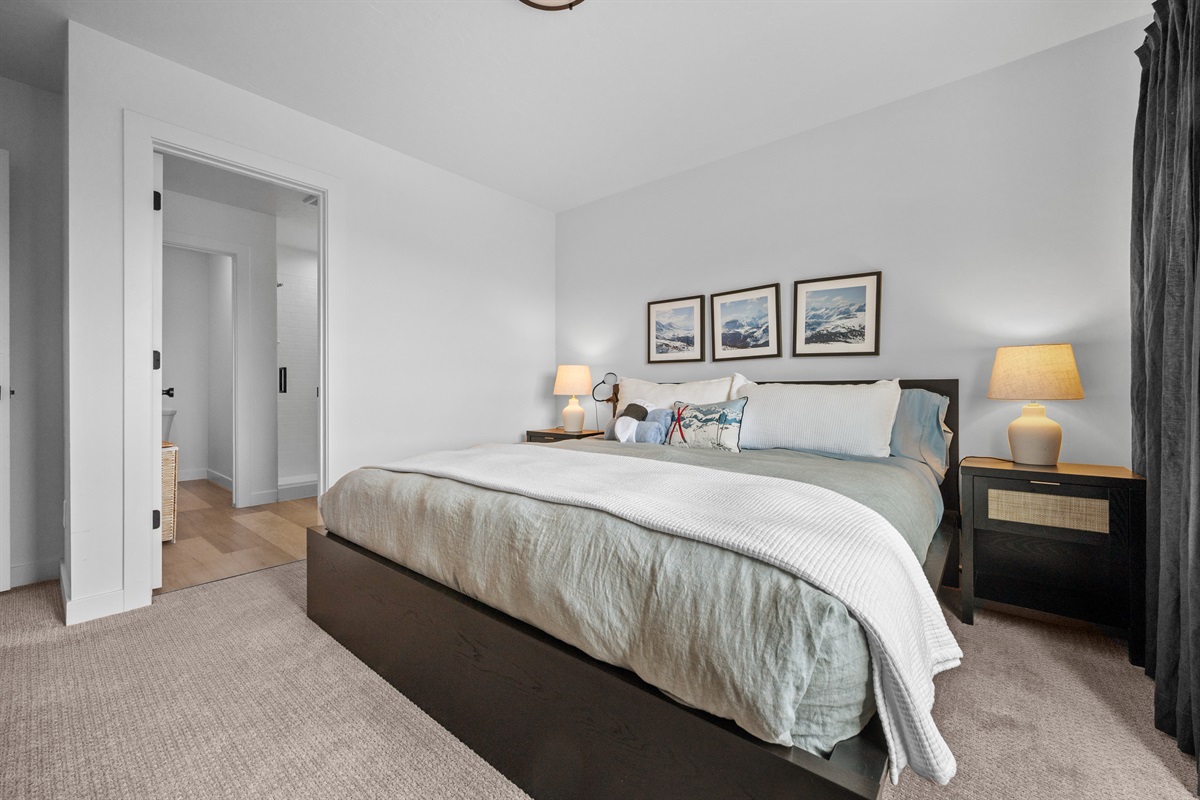 Spacious bedroom with stylish décor and plenty of natural light.