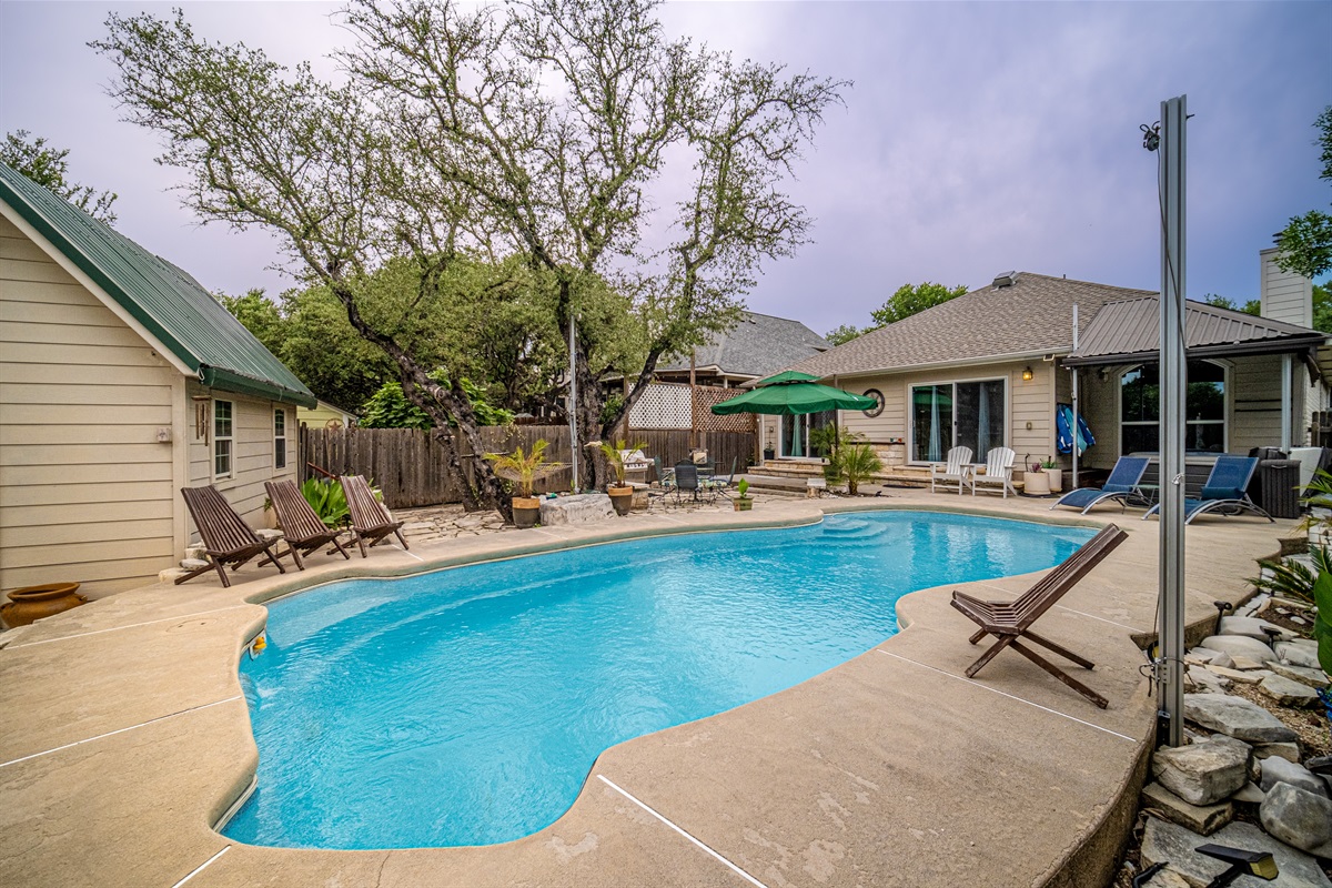 Welcome to your own private Backyard Oasis. Spa jets in pool bench seats & separate hot tub. Natural gas grill, oversized hammock for two, heated pool. Could it get any better?! Come, dive in ️