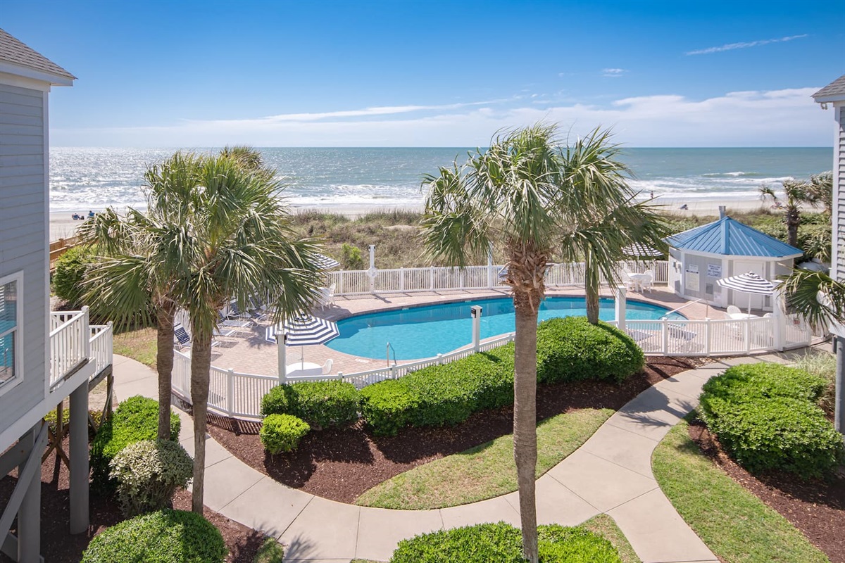 View from upper master bedroom balcony.  So close to the pool and beach!