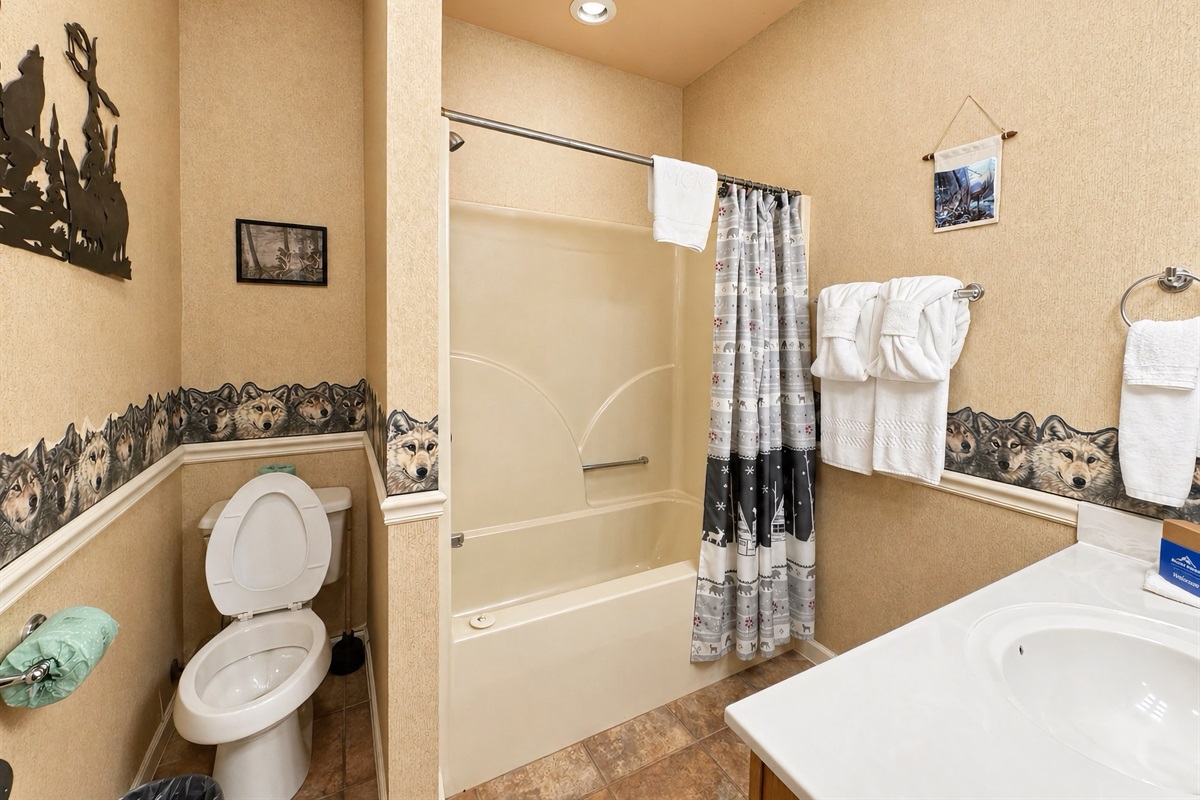 Bathroom #4 is a shared full bath in lower hallway with a tub/shower combo.