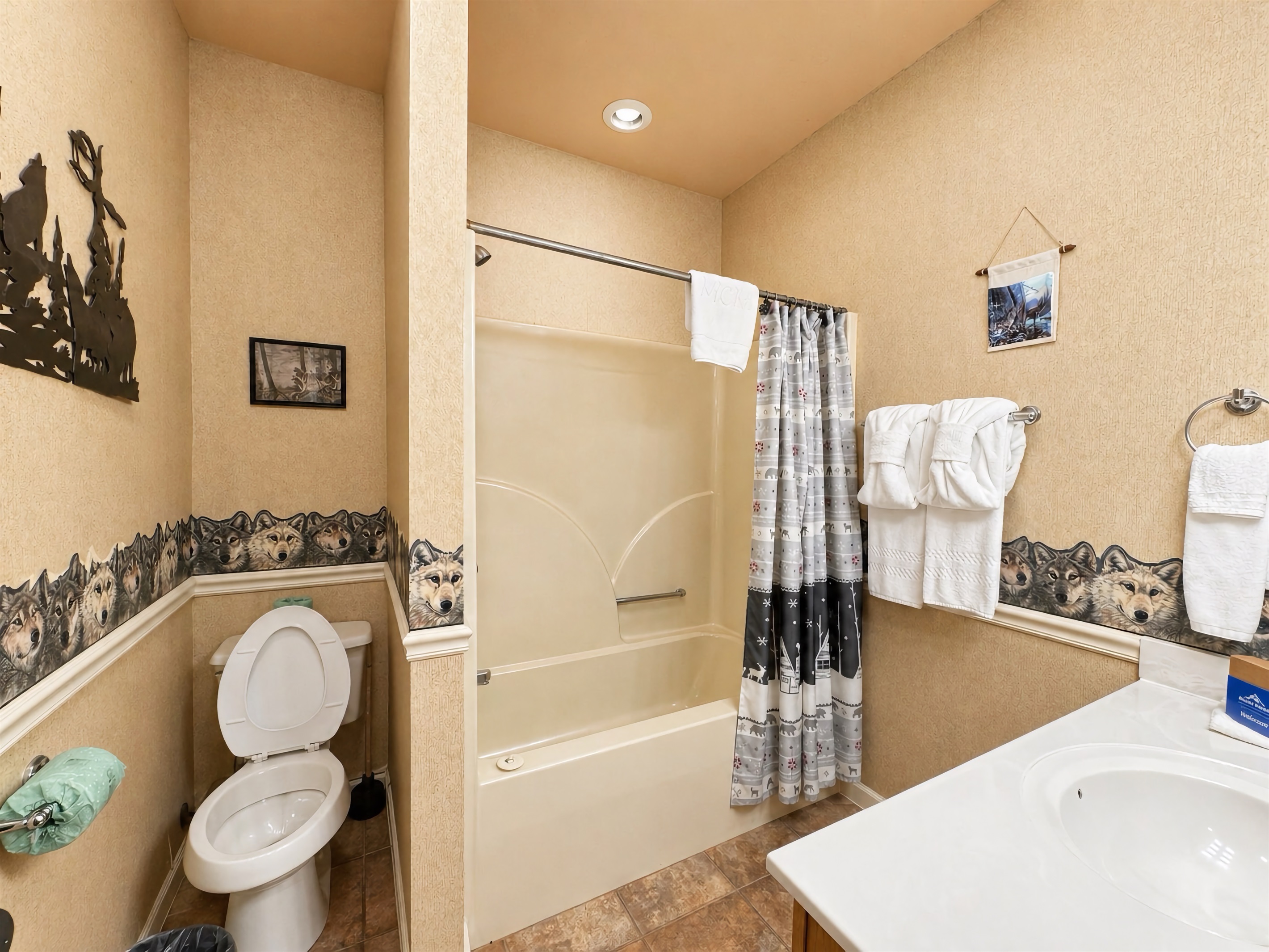 Bathroom #4 is a shared full bath in lower hallway with a tub/shower combo.