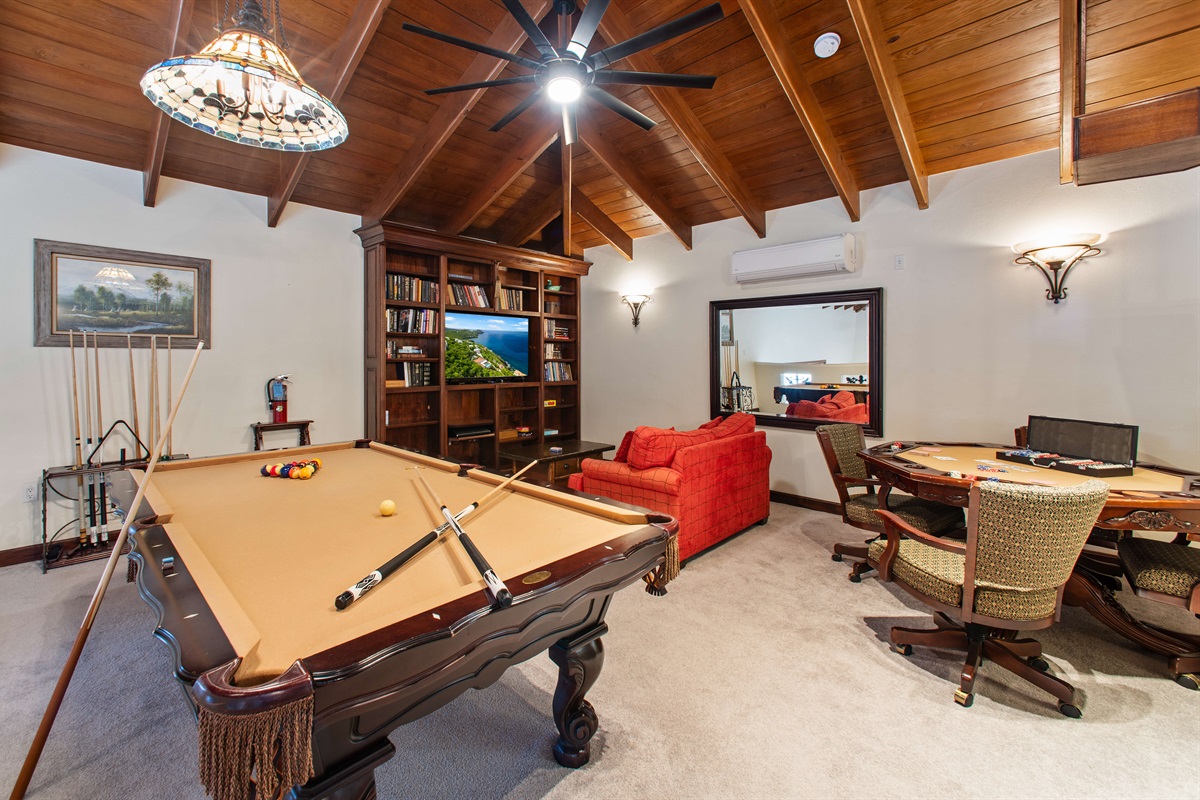 In the game room we have a pool table, poker table, a marble chess table, and twin sleeper sofa.