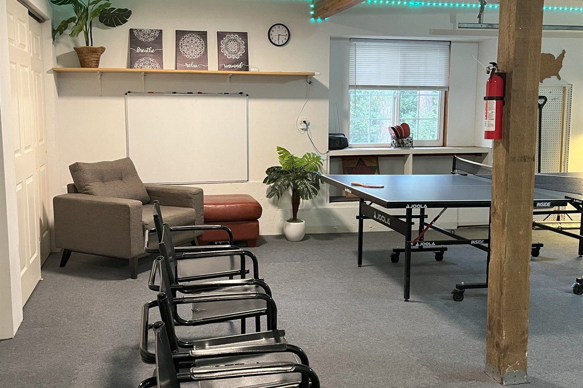 Game room has comfortable seating for spectators and a large white board for artist :-)