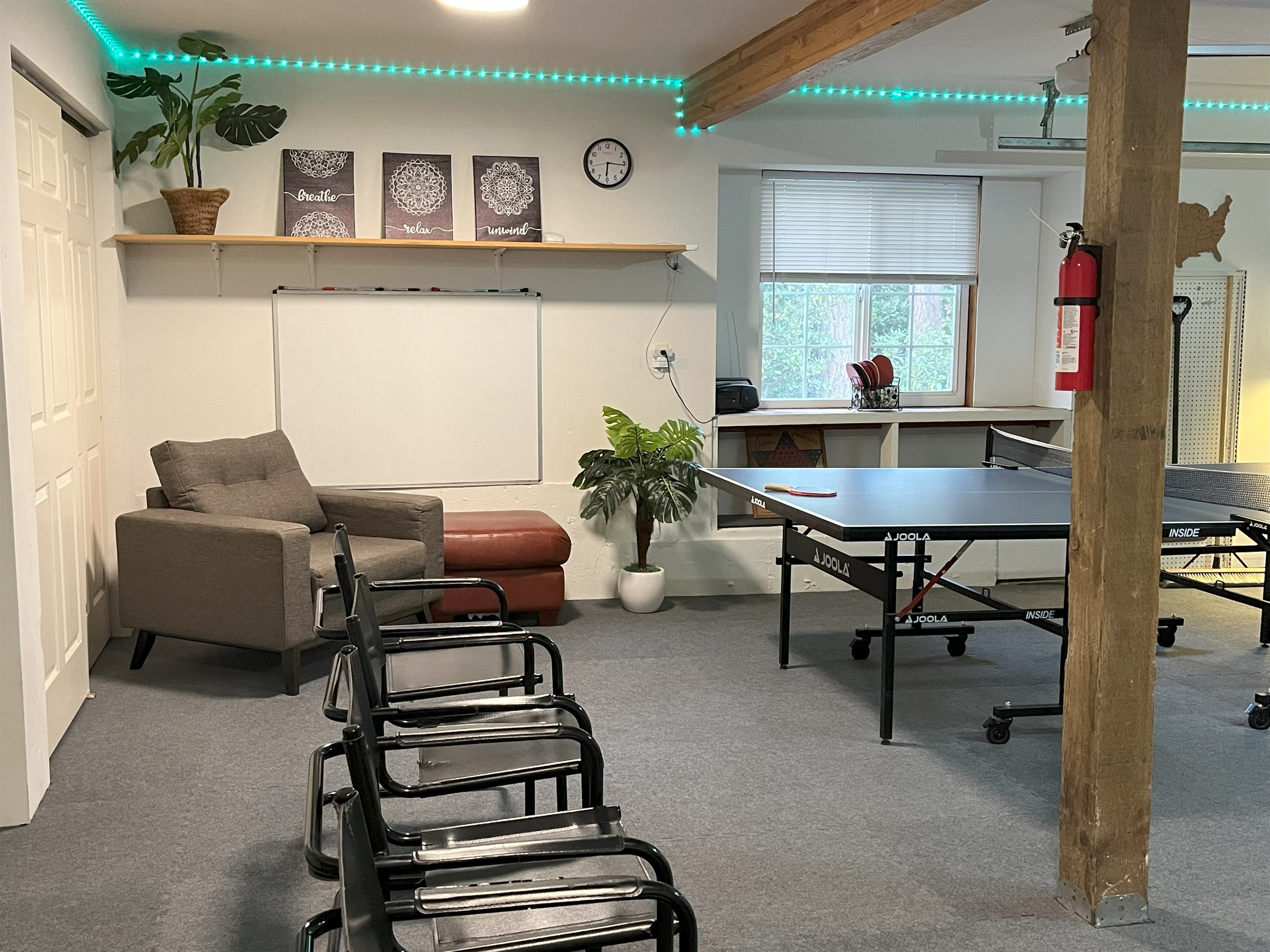Game room has comfortable seating for spectators and a large white board for artist :-)