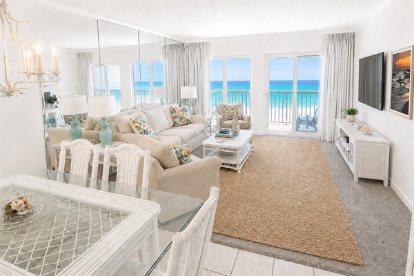 Incredible gulf views from living room/dining room and master bedroom.  This living room has a pull out queen sofa.  Seating on the balcony for four with a small table.