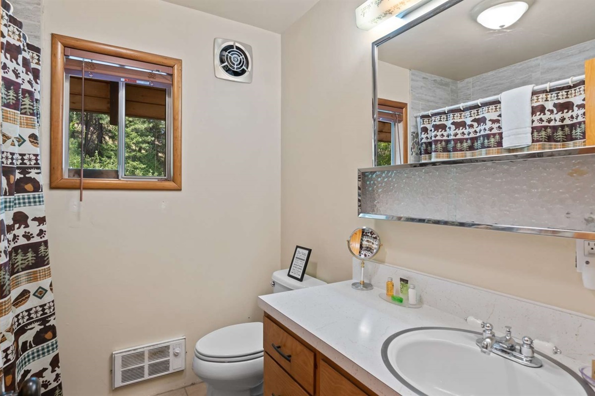 Full bathroom with tub/shower combo and fresh linens provided.