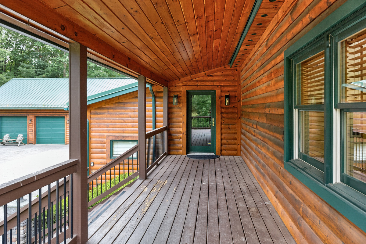 Wooden front porch entrance of the house 