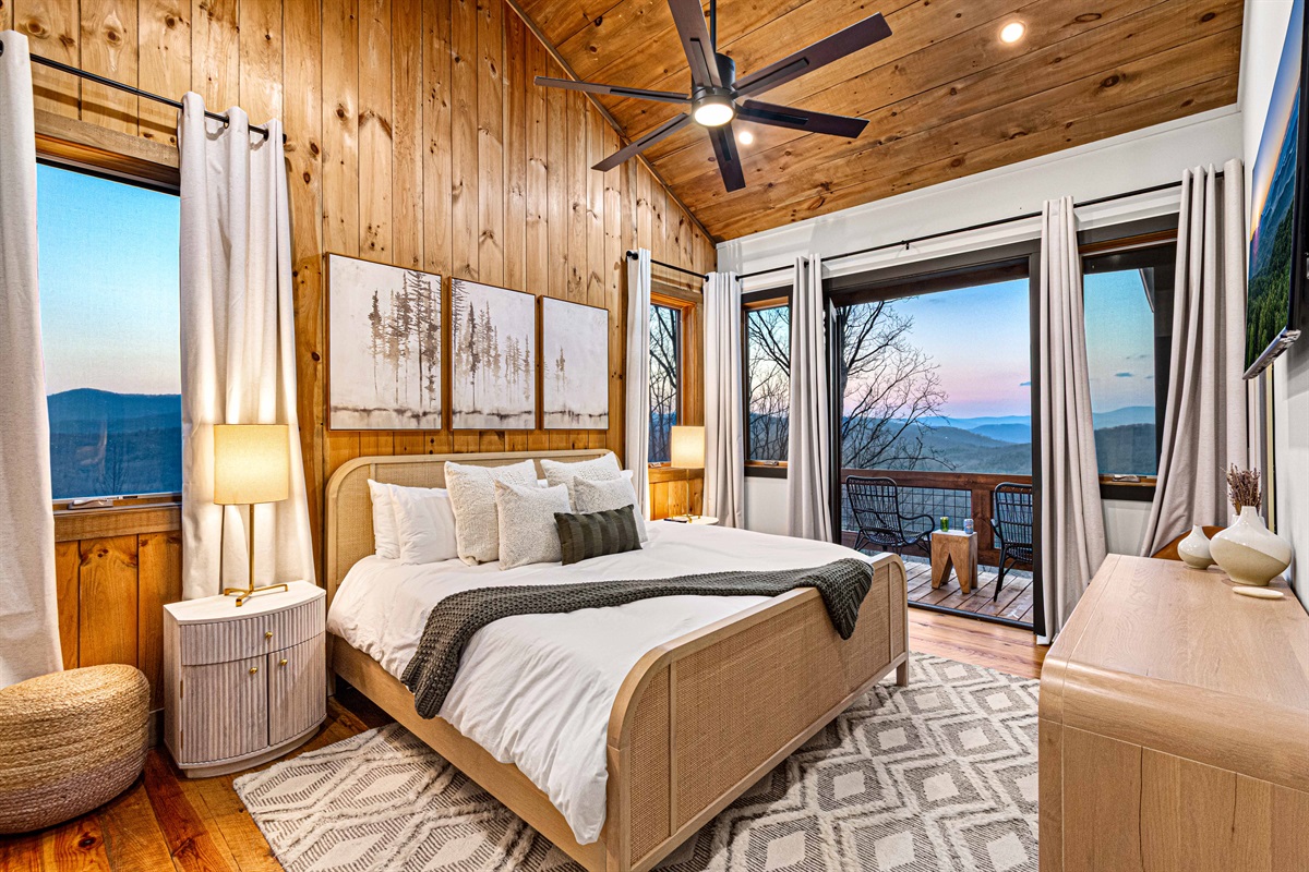 Tranquil master bedroom with entry to the top deck and adjacent seating