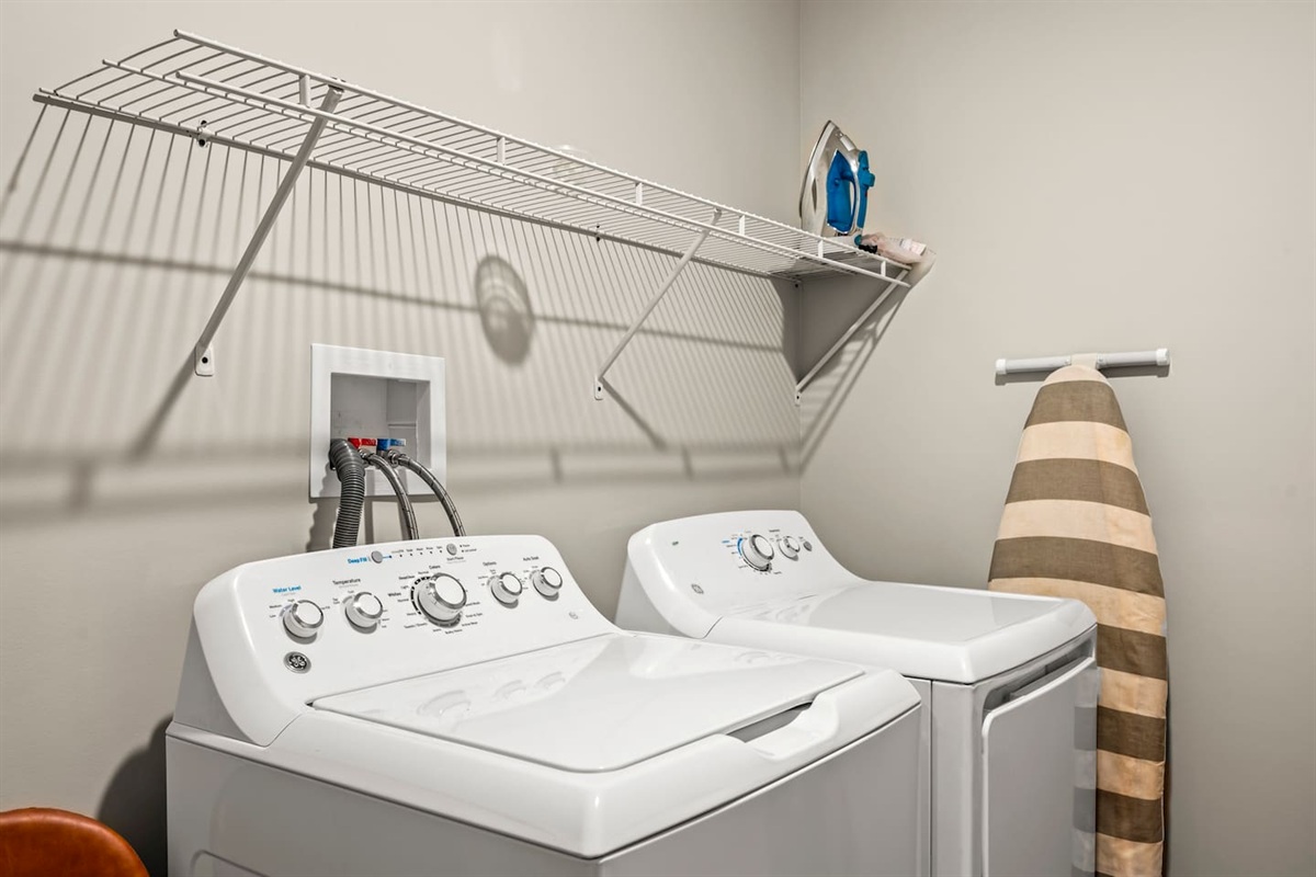A dedicated laundry space equipped with a high-capacity washer and dryer, making mid-trip refreshes effortless.