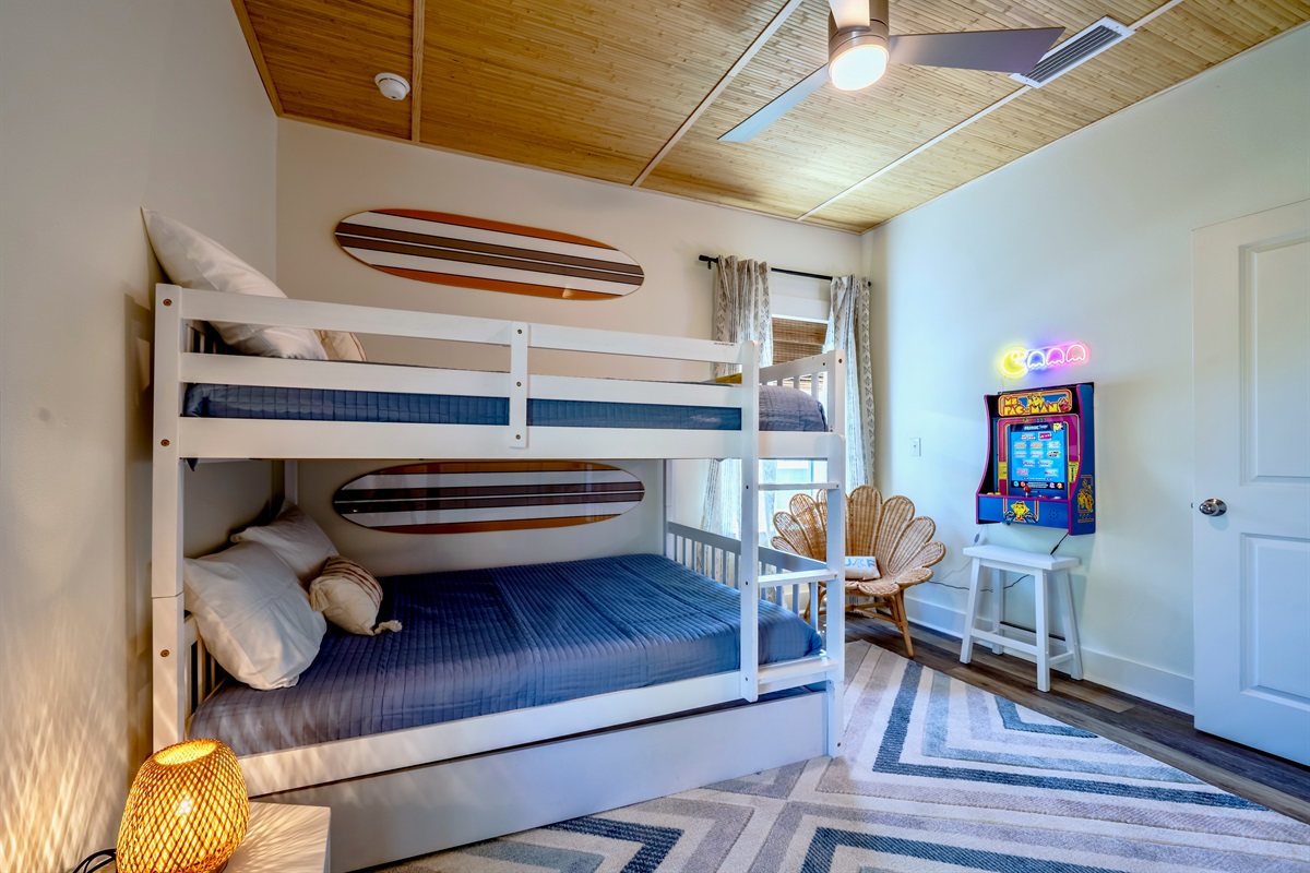 Full over Full bunk bed with a twin trundle and Ms. Pac-Man arcade game - for extra fun!