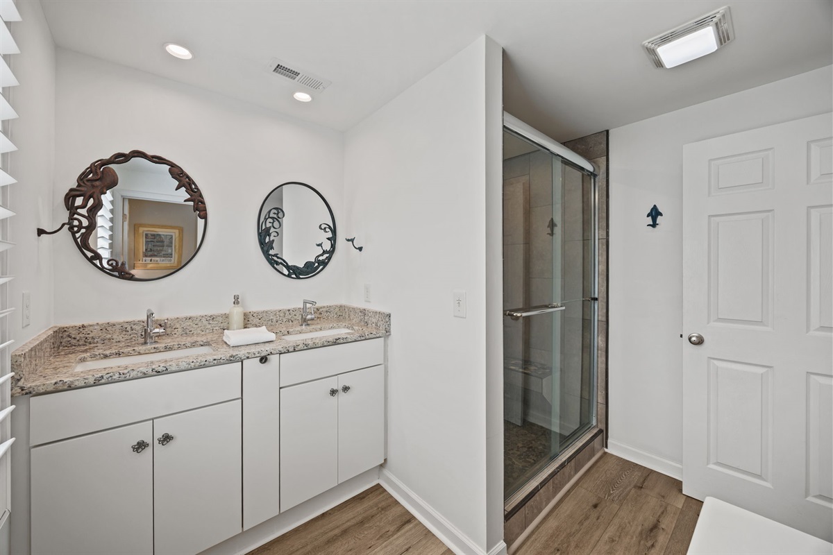 Double vanity with coastal mirrors