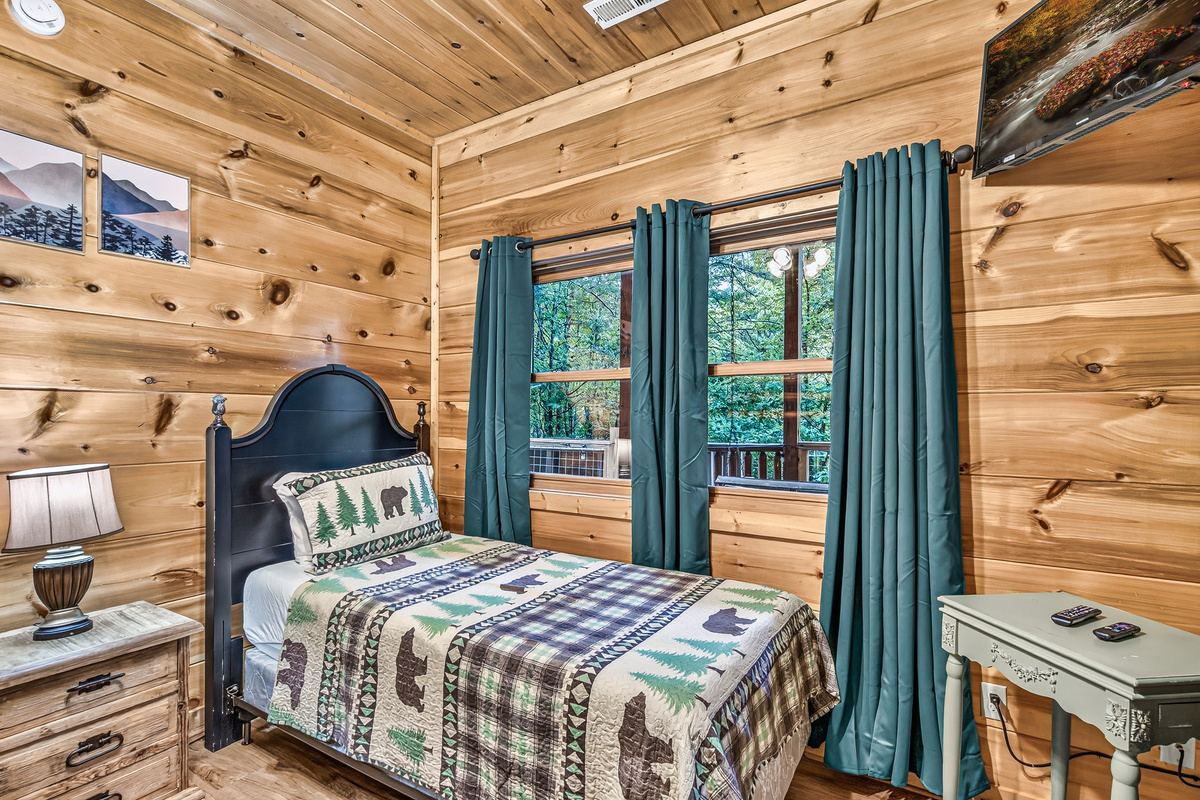 Wake up to soothing forest views right from the comfort of this cozy bedroom