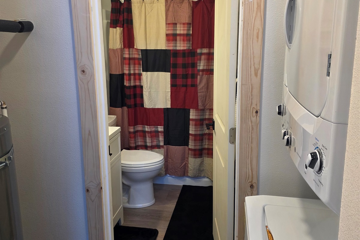 Washer/Dryer located just outside of the bathroom door.