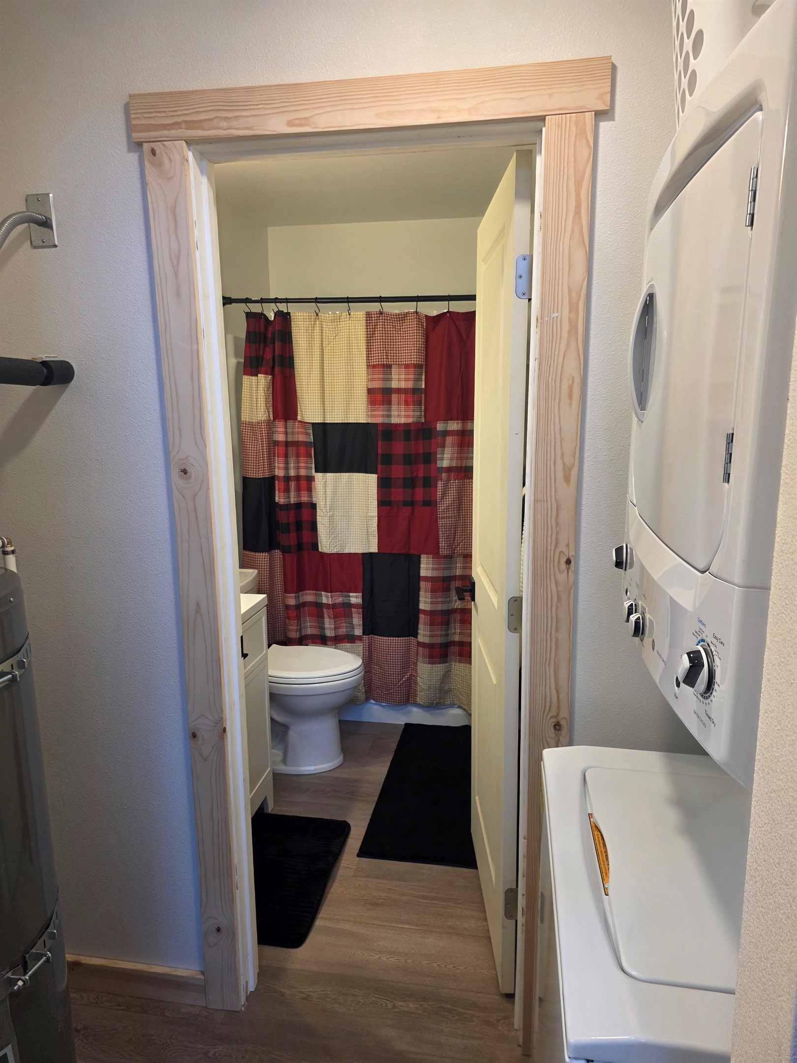 Washer/Dryer located just outside of the bathroom door.