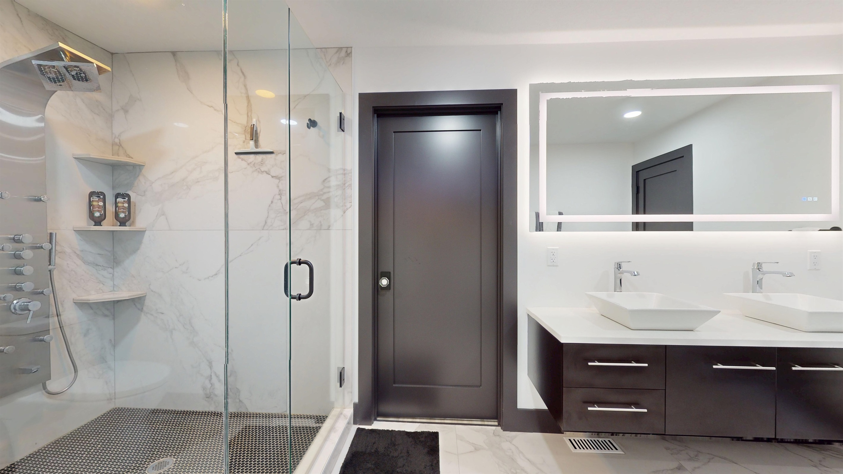 The main primary bathroom has an entry into the Primary Walk-In Closet and an entry into the Primary Bedroom.