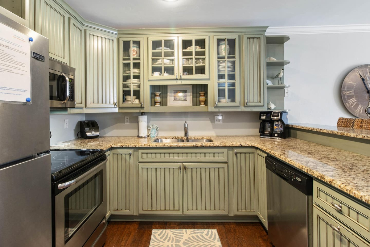 Pulling morning duty in this kitchen won't mind &mdash; granite counters, stainless appliances, and the Keurig already waiting. Cooking here actually feels like part of the vacation.