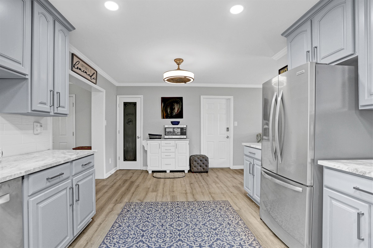 Enjoy the airy, open layout—this kitchen flows effortlessly into the living and dining areas, keeping everyone connected.