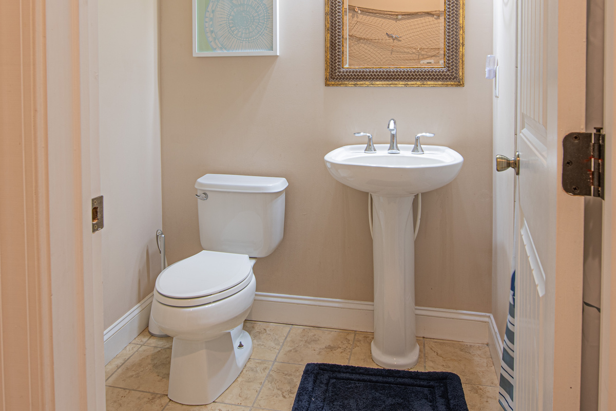 Half Bathroom Powder Room with Pedestal Sink and Toilet