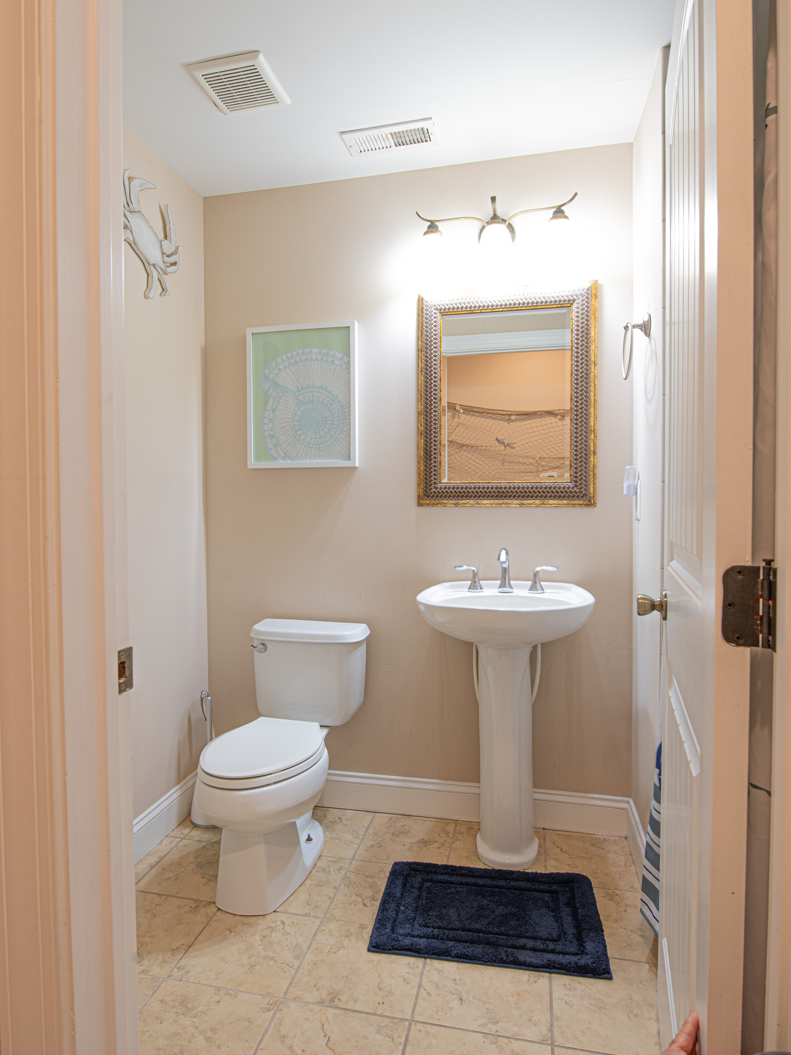 Half Bathroom Powder Room with Pedestal Sink and Toilet