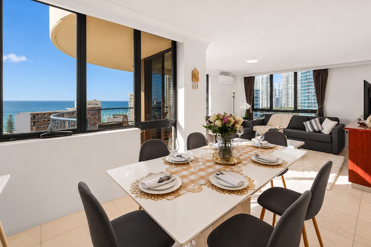 Open-plan dining keeps the apartment feeling bright and connected, with natural light moving through the kitchen, lounge and meal area.