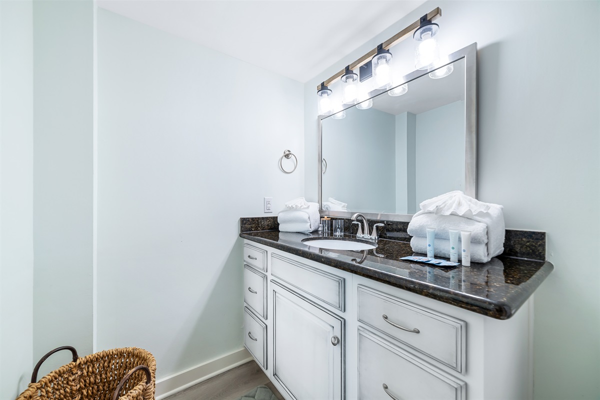 Modern updates meet classic comfort in this bathroom.  Clean lines and thoughtful design provide a relaxing experience.