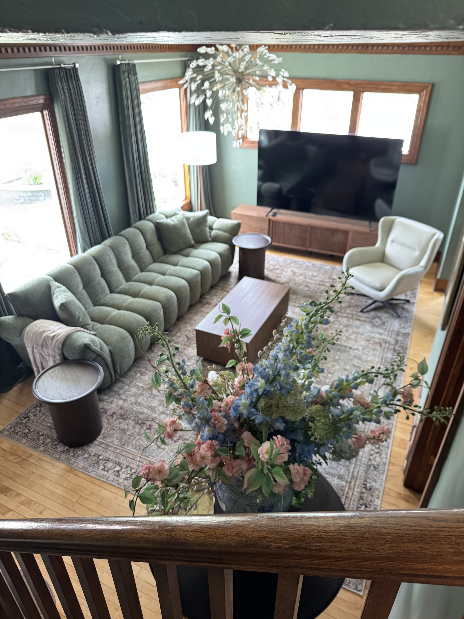 This spacious living room gives you a comfortable spot to stretch out, chat, or watch TV together.