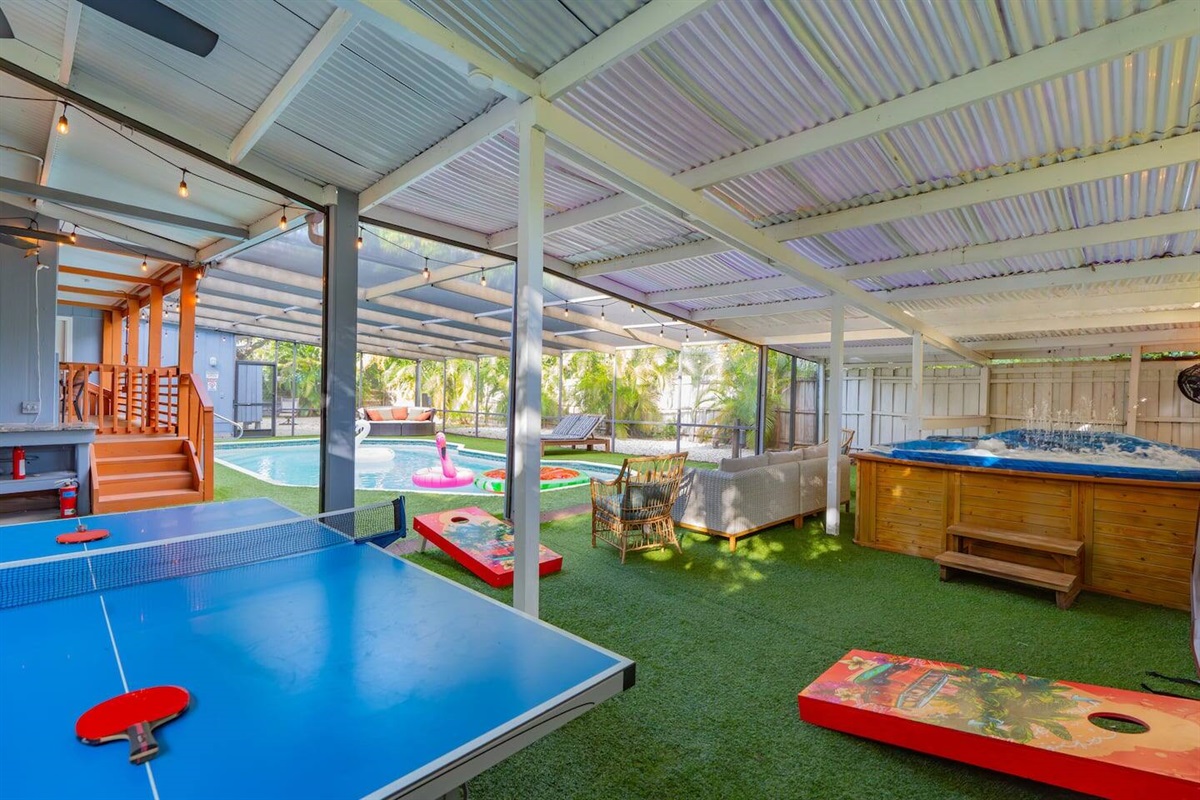 Screened Saltwater Pool with artificial non slip turf. Hot Tub, Ping Pong, Bucket Ball, & Corn Hole.