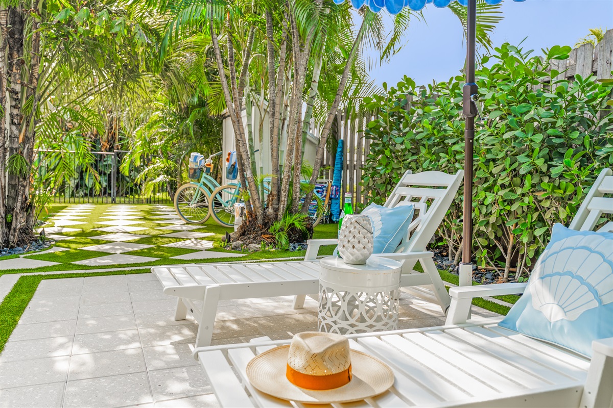 Soak up the sunshine on your private lounge chairs, surrounded by lush tropical landscaping and a peaceful garden setting.