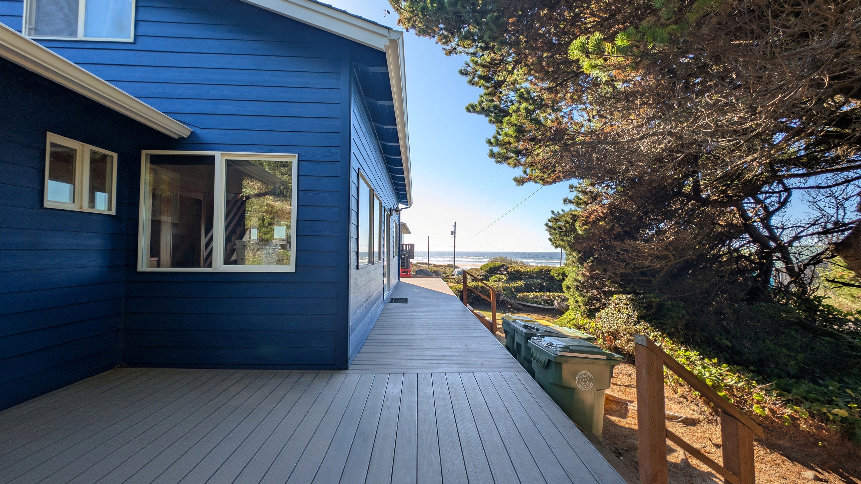 deck on North side of house with sliding glass door to living room