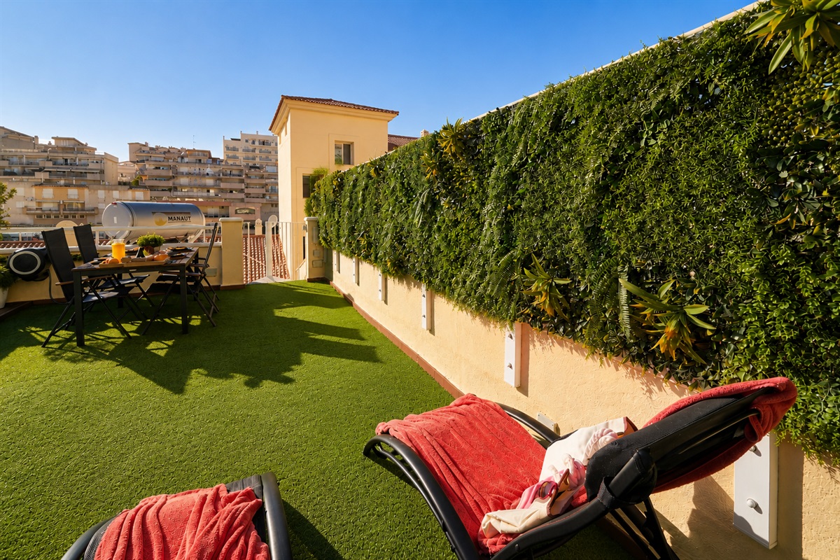 Stretch out on loungers or beanbags surrounded by lush greenery. A peaceful corner to read, nap, or soak up the Mediterranean sun in complete comfort and privacy.
