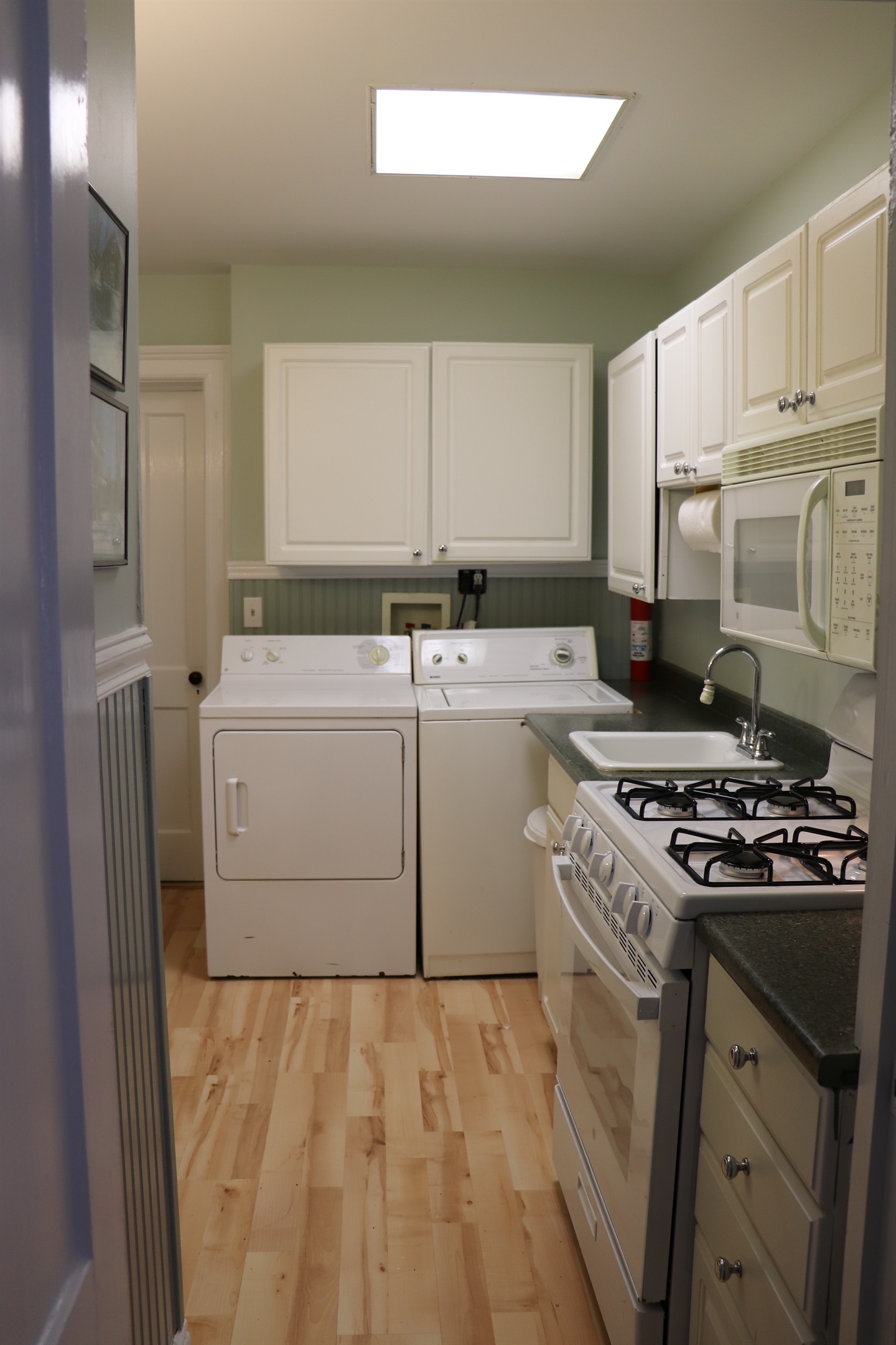 Kitchen complete with washer & dryer.