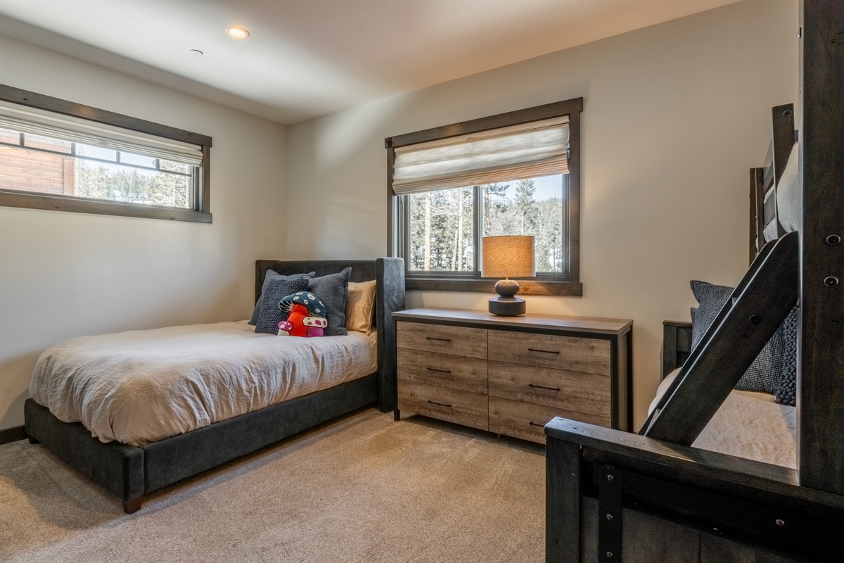 The standalone full bed offers a comfortable alternative for guests who prefer not to sleep in bunks—ideal for adults, teens, or anyone who likes a little extra personal space.