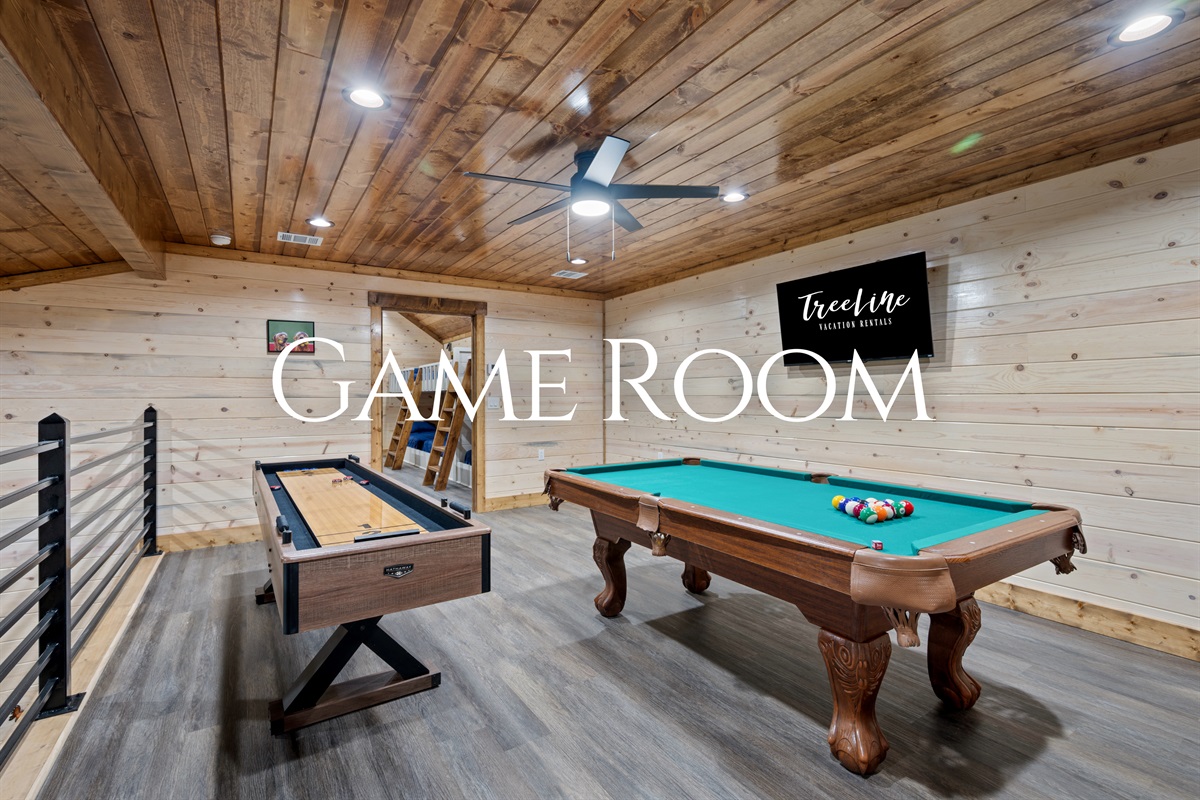 Head upstairs to the game loft where the pool table takes center stage, creating a fun and relaxed spot for friendly competition while still overlooking the warm, open living space below.
