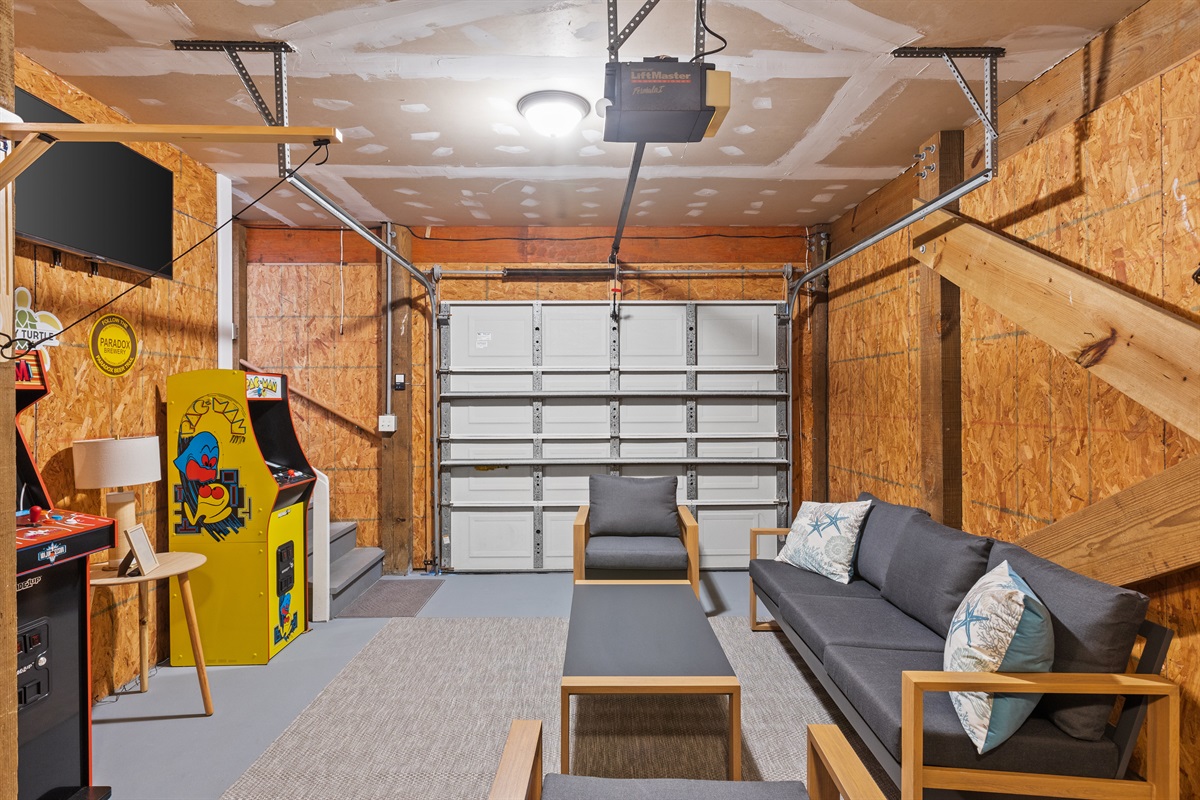 Entertainment Lounge with Arcade Games, TV and Comfy Seating 