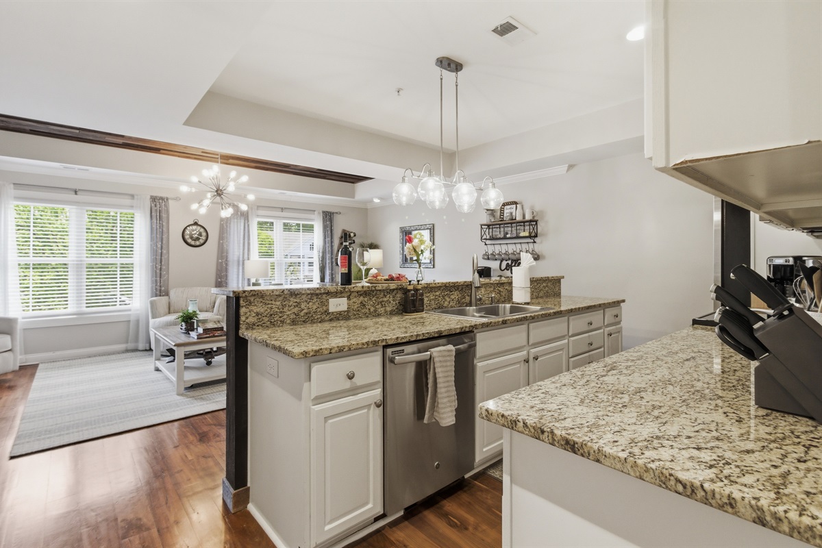 Modern kitchen with an open view of the living area.