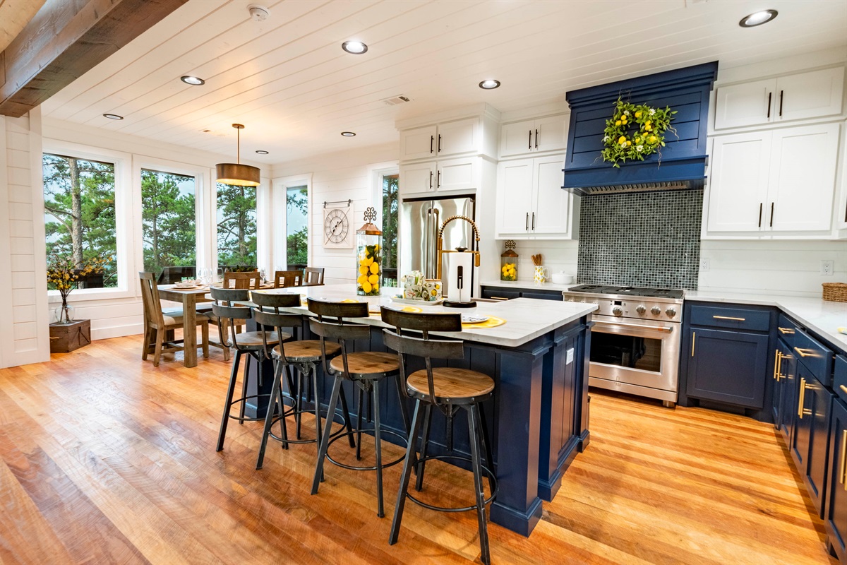 Fully equipped gourmet kitchen with modern finishes and spacious island seating