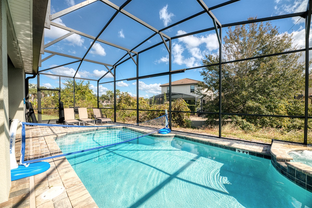Poolside Paradise: Dive into fun with our sparkling pool and volleyball net under sunny skies!